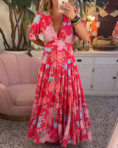 EP | Robe longue avec décolleté en V, manches courtes et boutonnage sur le devant.