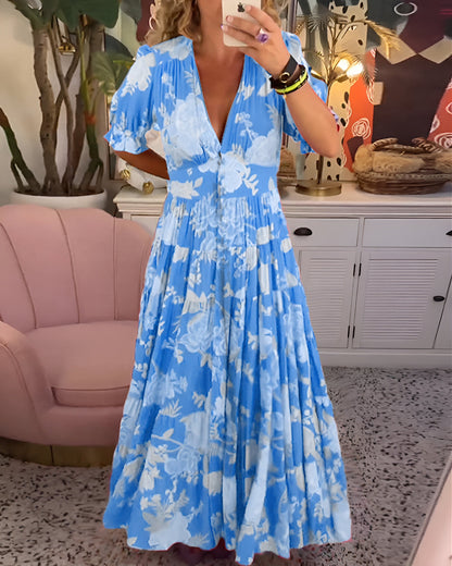 EP | Robe longue avec décolleté en V, manches courtes et boutonnage sur le devant.